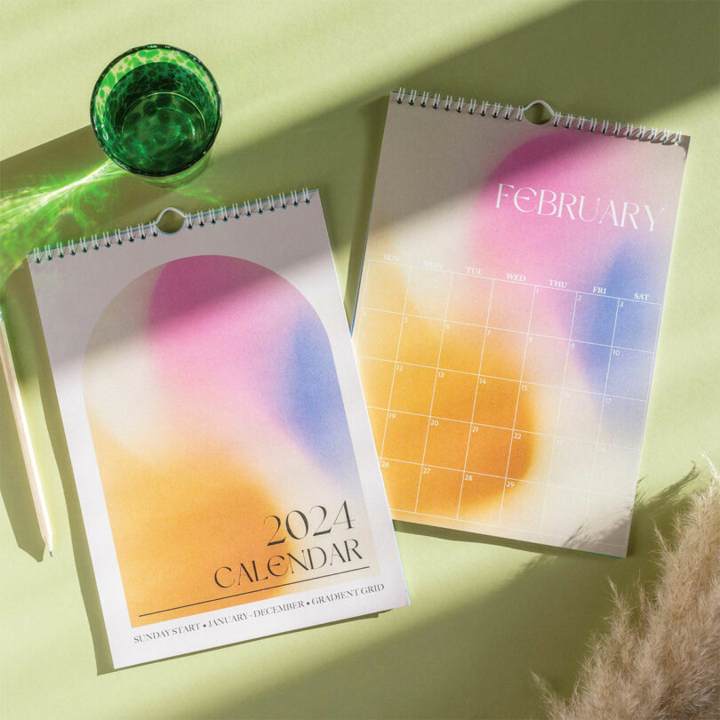 down shot of two calendars overlapping with colorful gradient design