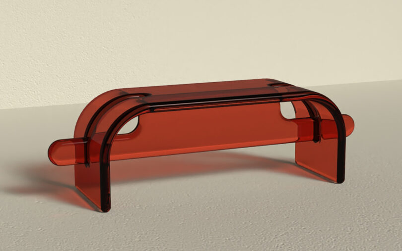 red resin bench on a beige background