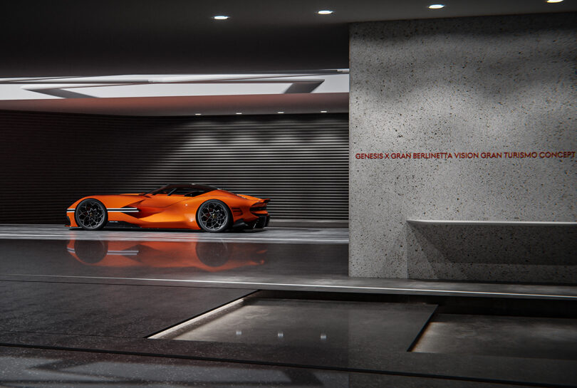Magma orange paint colored Genesis X Gran Berlinetta Vision Gran Turismo Concept parked in a virtual underground lot 