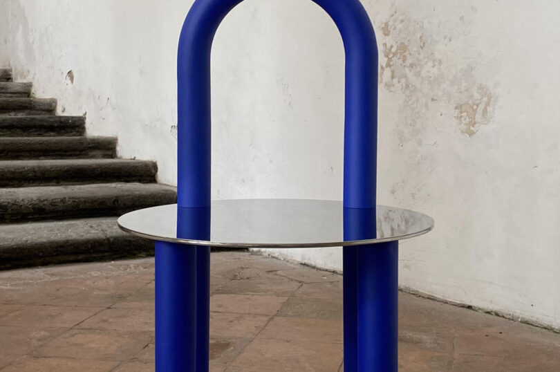 graphically shaped blue and mirrored side table