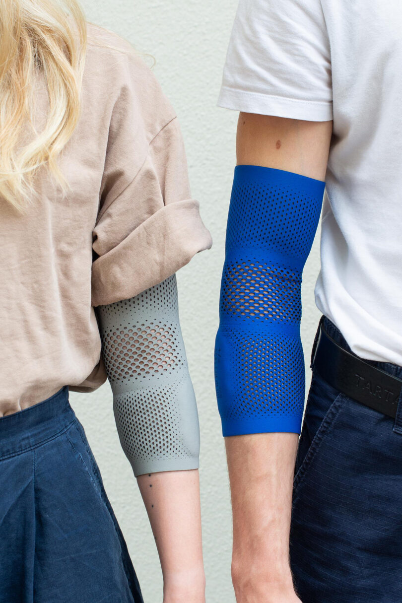 two people next next to each other wearing a brace around their elbows