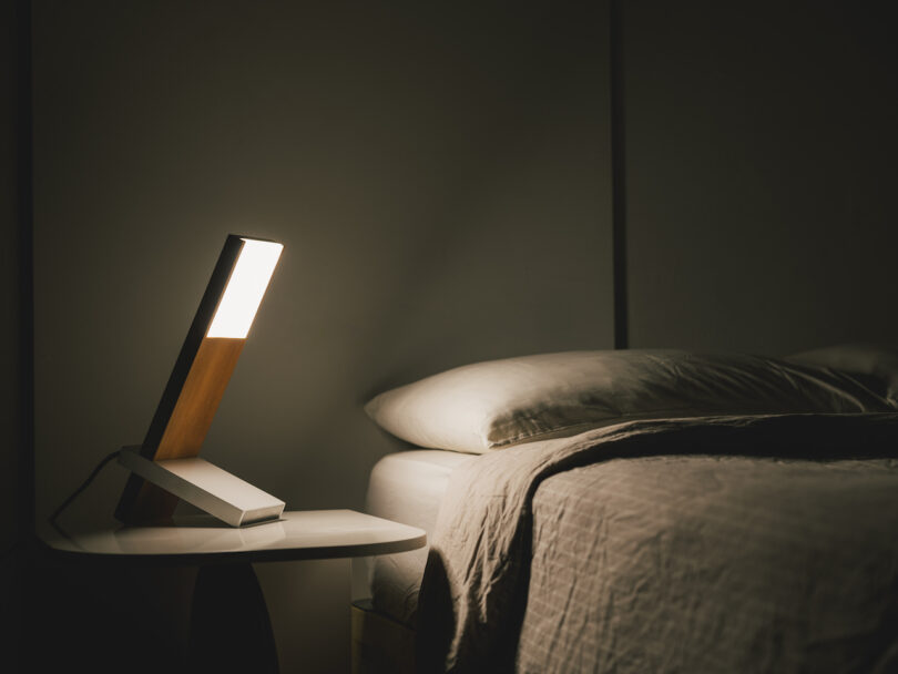 wooden table lamp on night stand