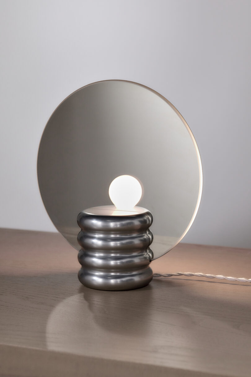 grey table lamp with transparent disc