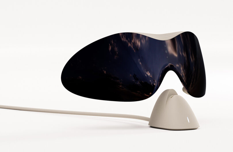 Morrama's Issé smart glasses concept floating above a charging stand.