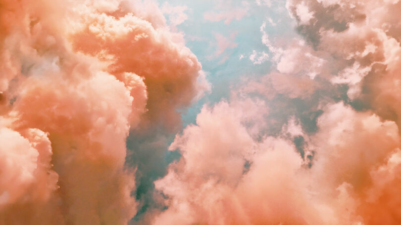 peach colored clouds with blue sky