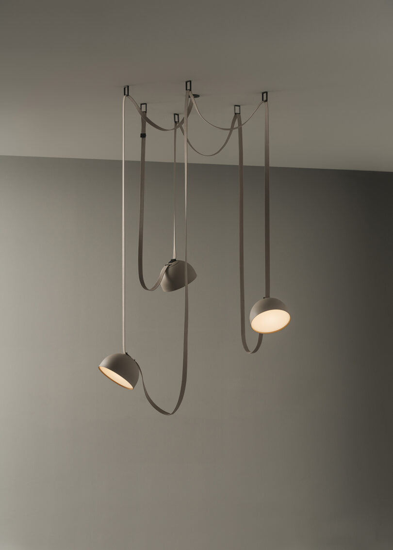 adjustable lighting system that uses "belts" to add and subtract pendants